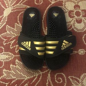 Never worn adidas gold and black adissage sandals